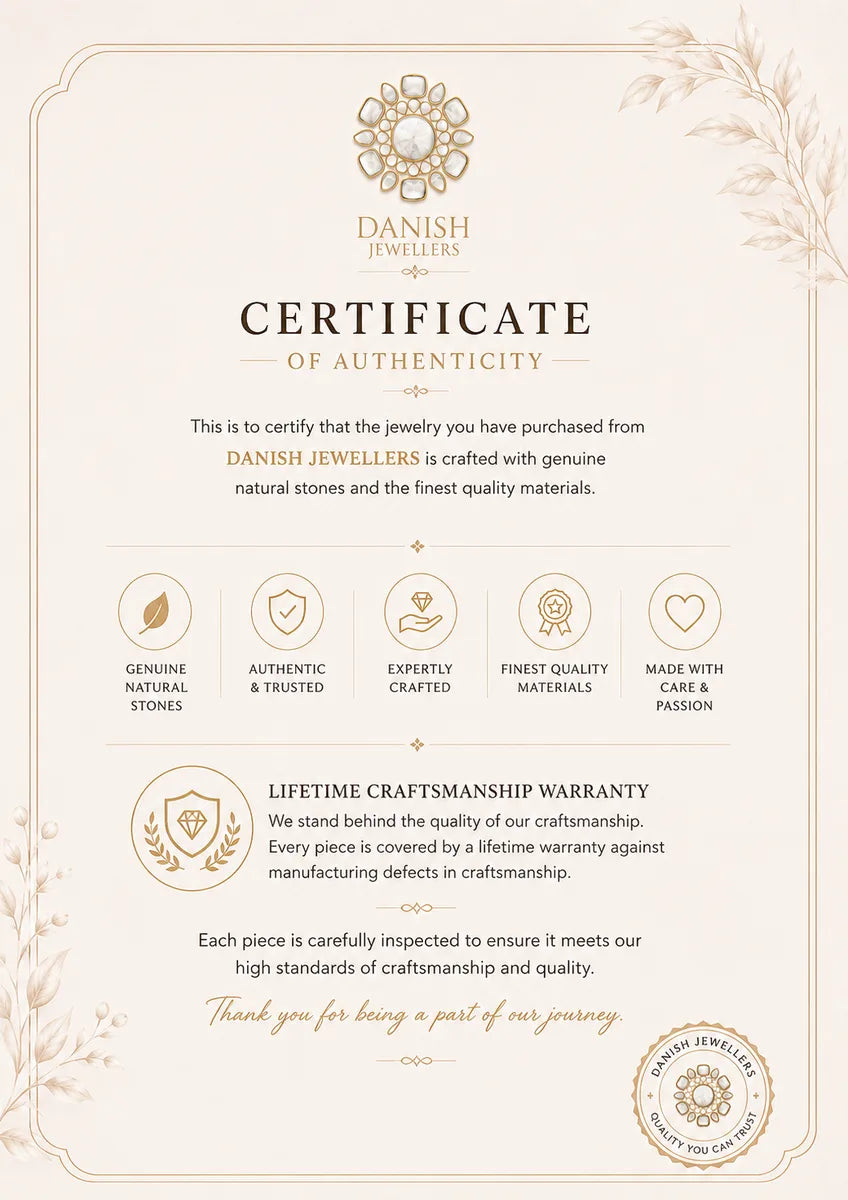 A decorative Certificate of Authenticity from Danish Jewellers, featuring elegant cream and gold typography, ornamental borders, and icons highlighting genuine natural stones, craftsmanship, and a lifetime warranty.